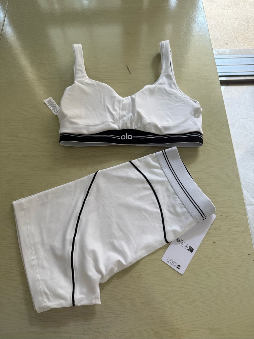 ALO Yoga White Sports Bra & Matching Shorts with Black Seam Detail - Picture 2 of 6